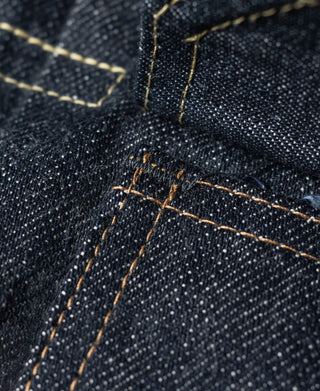 Indigo denim jacket topstitching and reinforced seam at pocket area