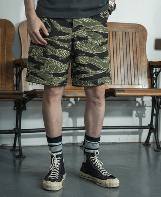 Camo tactical shorts with cargo-style pockets and button front, knee length