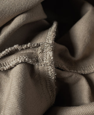 Khaki chino pants interior seam and stitched cuff edge