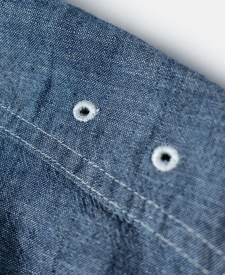 Blue chambray work shirt chest pocket with two front buttons