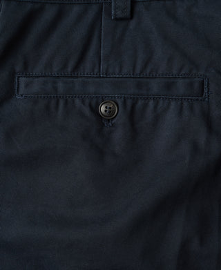 Navy cotton twill trousers front: button closure with belt-loop waistband and pocket opening.
