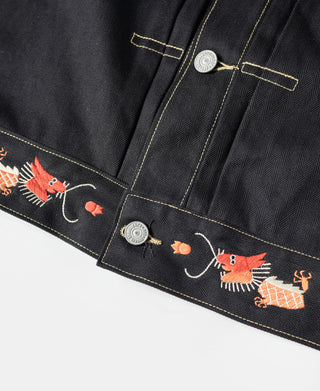 Black tour jacket hem with embroidered animals and small snap buttons