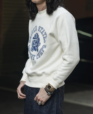 White raglan sweatshirt with blue “United States Marine Corps” chest graphic.