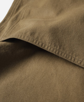 Khaki cotton canvas climbing pants, cuff hem seam close-up