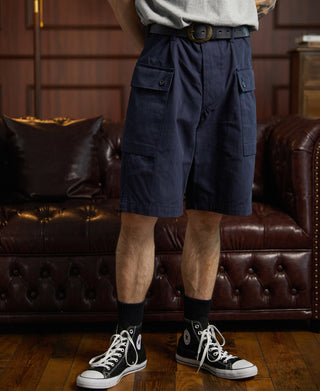 Navy utility shorts with cargo-style flap pockets and belt loops