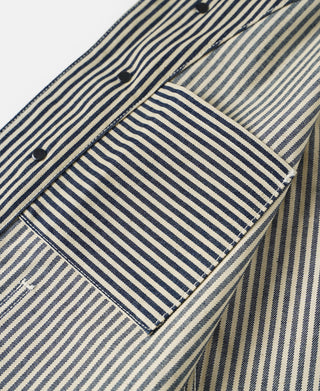 Striped vest interior with fabric label patch and small buttons