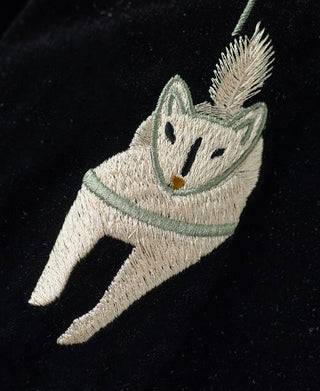 Embroidered green and cream animal patch on black jacket