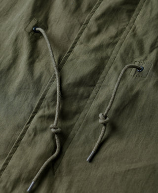 Olive M-65 parka with adjustable drawcord and grommets