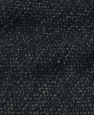 Close-up of dark salt-and-pepper wool weave with tiny speckled threads