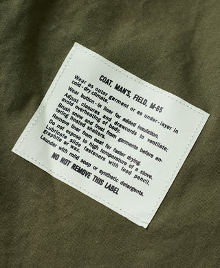 Olive field jacket inner care label