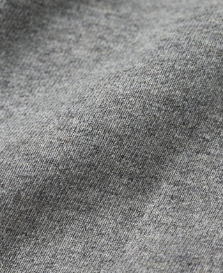 Heather gray hooded sweatshirt fabric closeup with subtle speckled texture