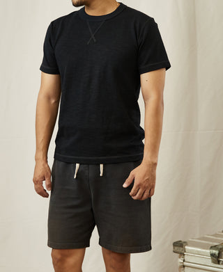 Black cotton crew-neck T-shirt with short sleeves and ribbed hem