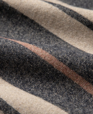 Woven stripe fabric with textured surface in black, gray, and beige tones