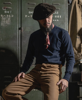 Navy long-sleeve henley shirt, button-front neckline and ribbed cuffs