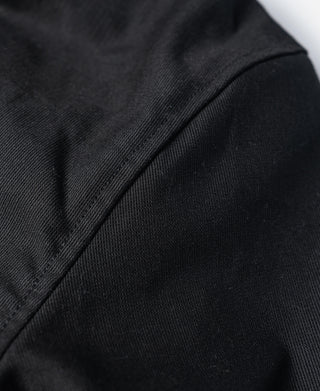 Black deck jacket side seam and smooth fabric detail