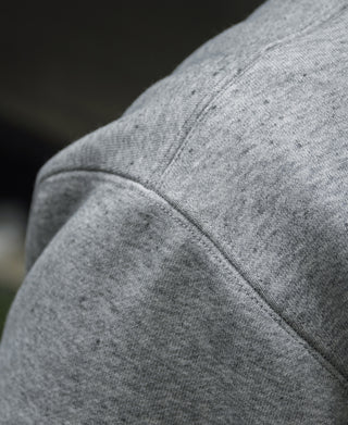 Gray fleece sweatshirt shoulder seam detail