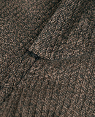 Brown salt-and-pepper striped pants close-up of stitch lines and texture grain