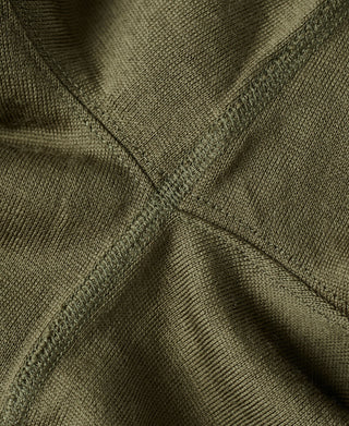 Olive wool knit shirt curved neckline seam close-up