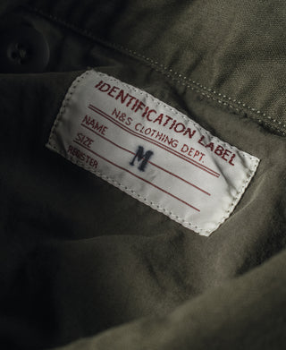 Olive field jacket interior identification label, size M