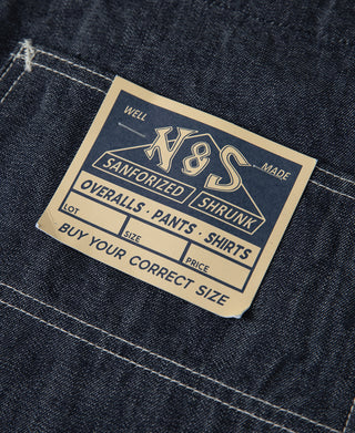 Indigo denim jacket stitched brand label on front panel