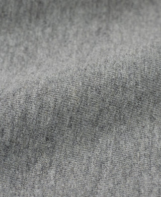 Heather gray reverse weave sweatshirt fabric close-up with speckled texture