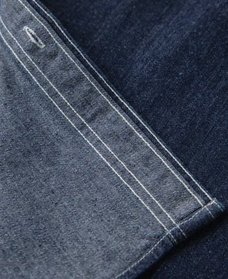 Denim workshirt pocket edge with double-needle topstitching, dark blue denim