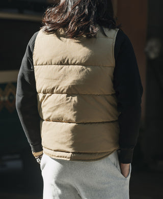 Khaki quilted padded vest back view with horizontal baffle panels