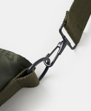 Olive nylon helmet bag with black metal carabiner and D-ring strap
