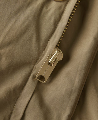 Khaki parka with gold zipper and metal zipper pull