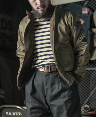 Apricot and navy striped long sleeve T-shirt worn with jacket and belt