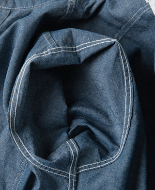 Blue chambray work shirt inner neck area with stitched collar seam