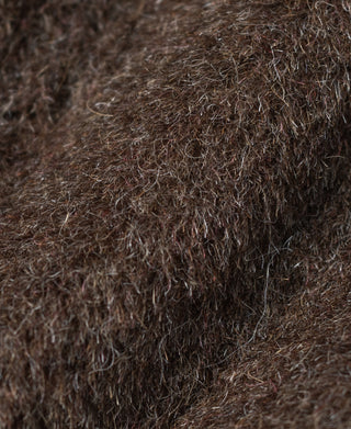 Dark brown fuzzy jacket insulation texture close-up