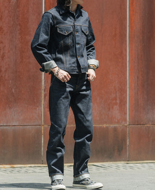 Indigo denim jacket worn with jeans, button front and flap chest pockets