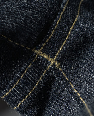 Indigo selvedge denim jeans, close-up of cross-stitching and selvage edge seam