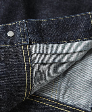 Indigo denim jacket interior pocket with light chambray lining and topstitching