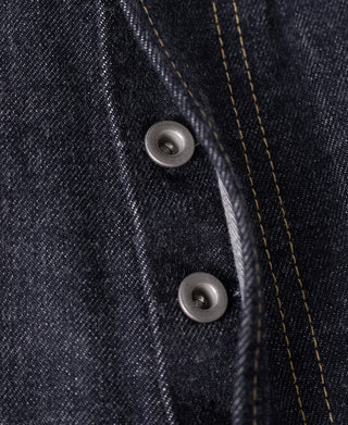 Selvedge denim jeans close-up of button placket and inner seam stitching