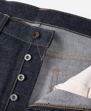 Selvedge denim jeans button fly and front pocket stitching with dark denim panels