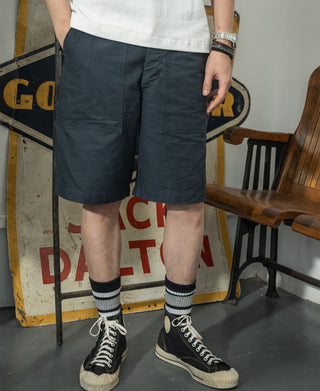 Navy utility shorts with pleated front and side pockets