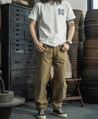 Khaki deck pants with relaxed fit, cargo pockets, and cuff detailing
