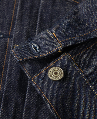Indigo denim jacket chest pocket with flap and round branded metal button