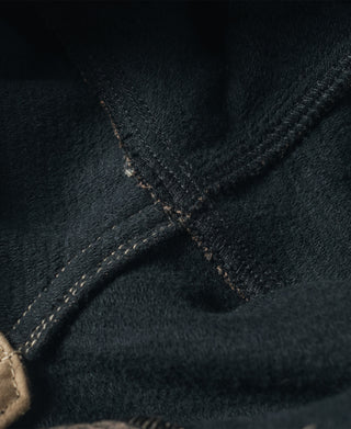 Pique salt-and-pepper stripe pants, close-up of side seam and stitched panel