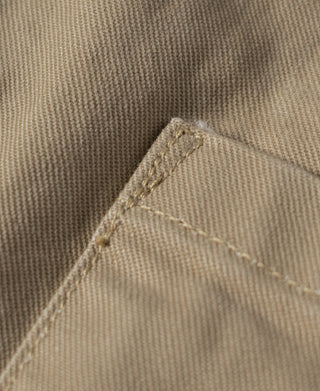 Khaki combat pants close-up of fabric weave and curved topstitching