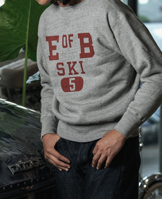 Gray sweater with long sleeves and red "E OF B SKI 5" front graphic