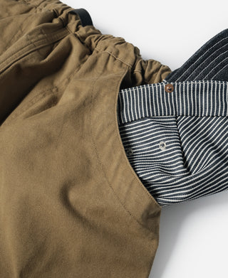 Khaki cotton canvas climbing pants with striped inner waistband and drawstring