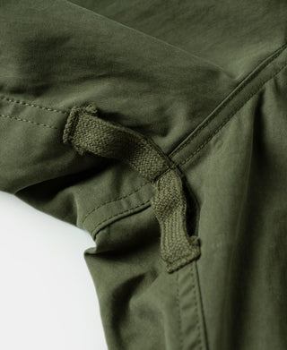 Olive shell arctic trousers with drawstring cord and seam stitching at ankle