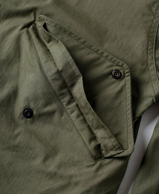 Olive M-65 parka with snap button placket and flap pocket
