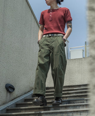 Olive utility fatigue pants with relaxed straight legs and cargo pockets