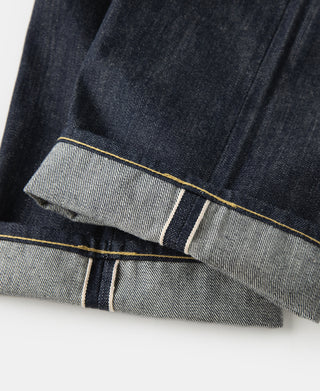 Indigo denim jeans cuff with selvedge stripe and contrast stitch detail