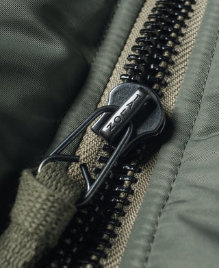 Olive MA-1 flight jacket, metal zipper pull with black puller on fabric tape