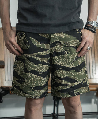 Camo cargo shorts with two front patch pockets and button closure